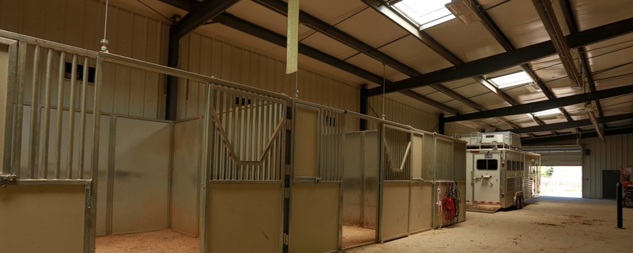 horse stables located inside custom built horse arena